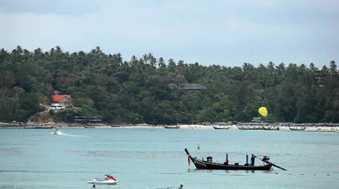 People walking, swimming, snorkeling, Kata Beach in Phuket Island, Thailand Stock Footage