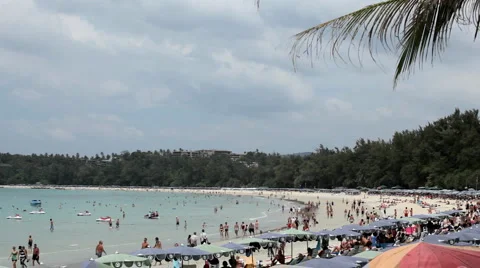 People walking, swimming, snorkeling, Kata Beach in Phuket Island, Thailand Stock Footage
