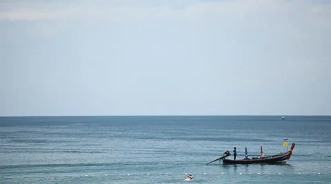 People walking, swimming, snorkeling, Kata Beach in Phuket Island, Thailand Stock Footage