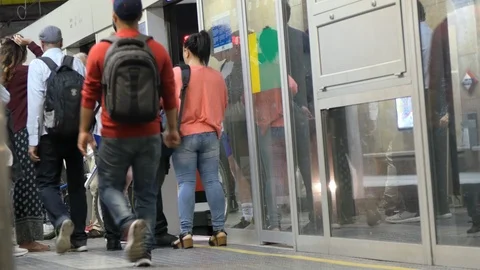 People Walking taking the Train in a Underground Station Stock Footage 89799263