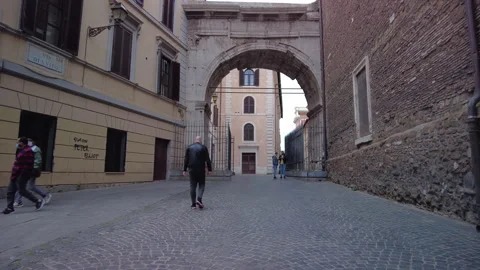 People walking through the Arch of Gallienus, known as the Porta Esquilina Stock Footage 153500053