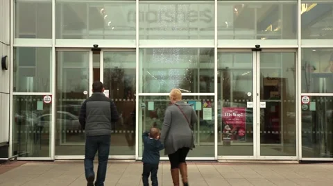 People walking through automatic doors at shopping mall Stock Footage 44641678