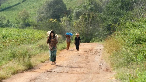 People walking through Burma crops, Asia in 4K Stock Footage 94917419