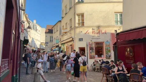 People walking through the charming streets of Montmartre in Paris Stock Footage 337783750