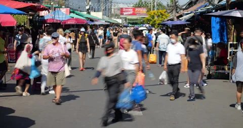 People walking through Chatuchak Weekend Market in sunny day, time-lapse shot Stock-Footage 326375006