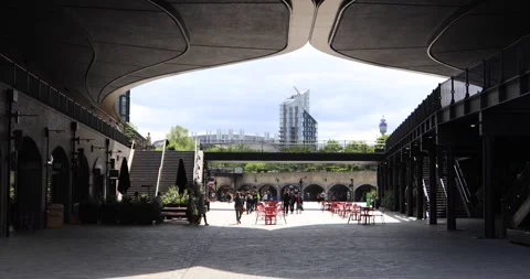 People walking through Coal Drops Yard courtyard in London Stock Footage 321032722