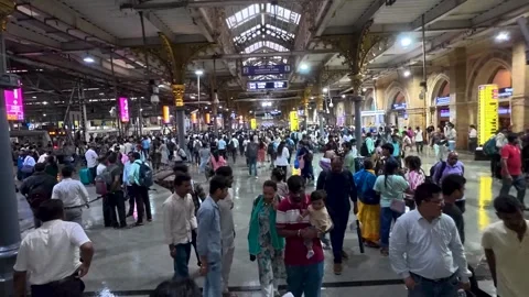 People walking through crowded CSMT railway station in Slow Motion Stock Footage 338171524