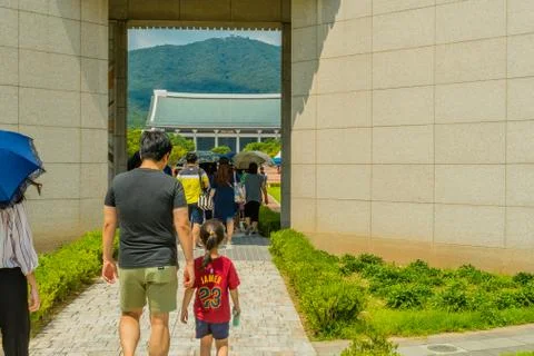 People walking through gate. Stock Photos
