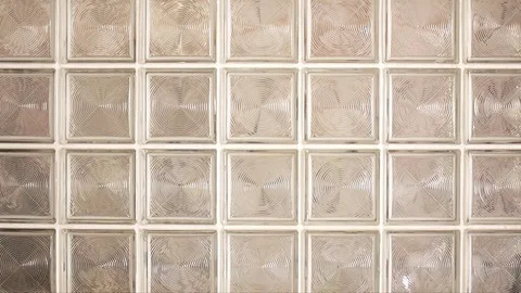 People Walking Through a Glass Blocks Wall Stock Footage 78802263