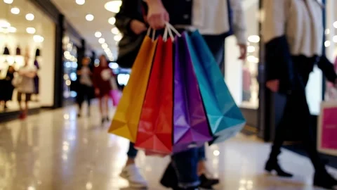 People walking through a mall with many colorful bags, Black Friday, shopping Stock Footage 315654598