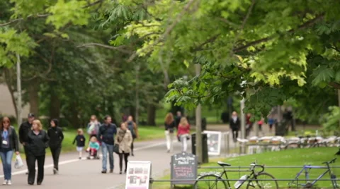 People walking through the Meadows in Edinburgh, Scotland Stock Footage 58001590