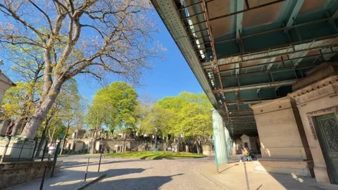 People walking through Père Lachaise Cemetery in Paris Stock Footage 337521147