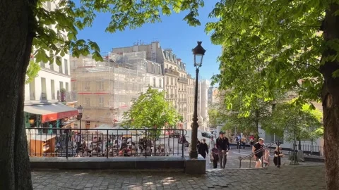 People walking through Place Émile Goudeau in Montmartre, Paris Stock Footage 337784044