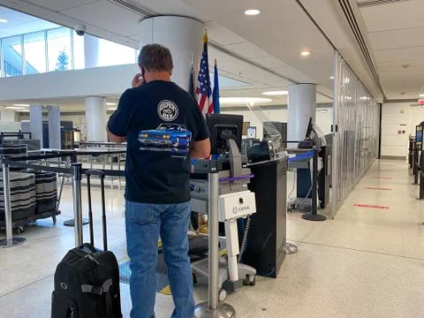 People walking through the security line at St. Louis, MO Lambert Internation Stock Photos