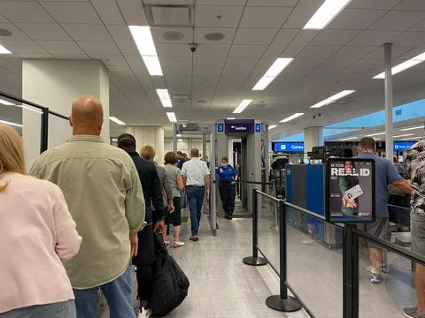 People walking through the security line at Orlando International Airport MCO Stock Photos