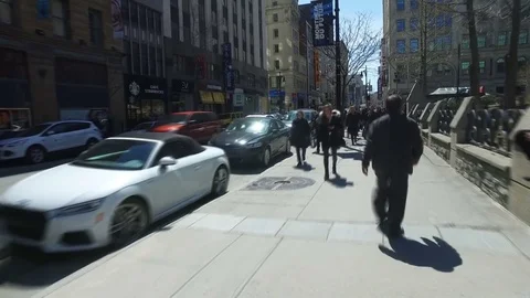People walking Through Sidewalk Stock Footage 75820593
