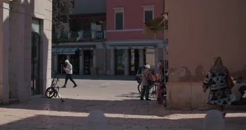 People walking through a square in Rovinj old town Video stock 334336804