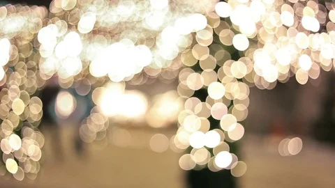 People walking through streets decorated with garlands Stock Footage 74313032