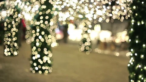 People walking through streets decorated with garlands Vídeo Stock 75841747