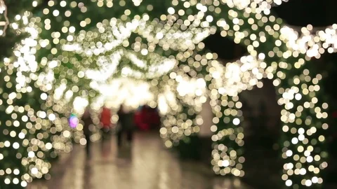People walking through streets decorated with garlands Stock Footage 81096747