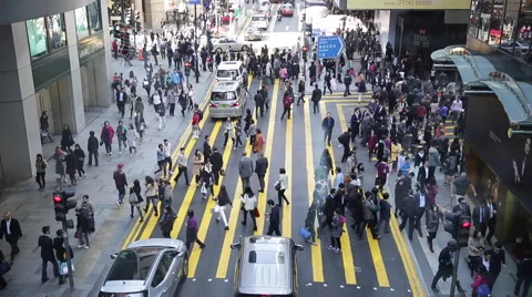 People walking through a zebra crossing in Hong Kong Stock Footage 45409647