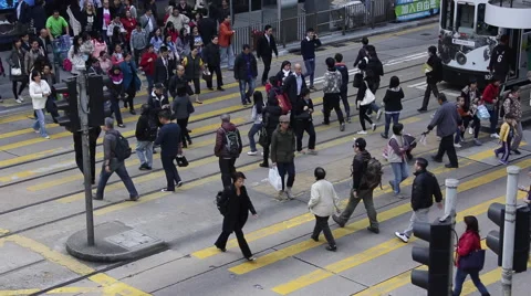 People walking through a zebra crossing in Hong Kong Stock Footage 45409925