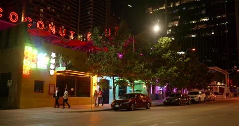 People walking together down the sidewalk in the downtown urban core of Austin Stock Footage 205475182