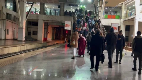People walking towards the exit of Rabat ville railway station in Rabat Stock Footage 231160205