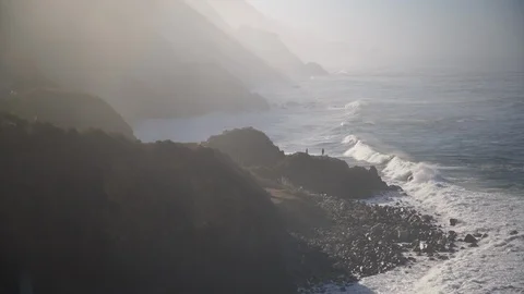 People walking towards the water on the cliffs Stock Footage 102417217