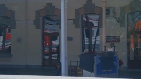 People walking at train station while train moves through in Russia Stock Footage 122444341