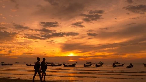 People walking on tropical beach at sunset. Koh Tao island Stock Footage 74684780
