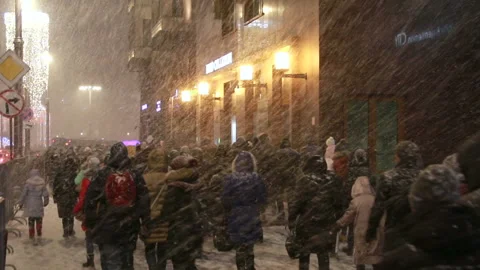 People walking under a heavy snowfall. Stock Footage 85797759