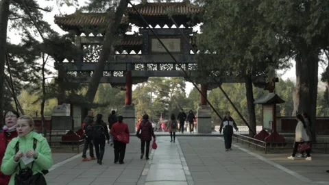 People Walking Under Ornate Gate in Summer Palace Beijing China Stock Footage 341782261