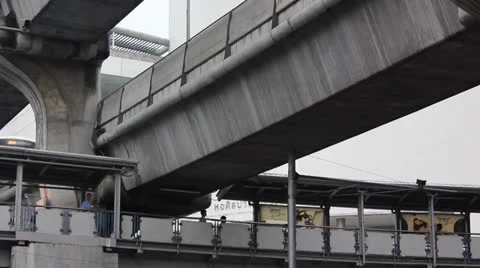 People walking under sky train line Stock Footage 24866080