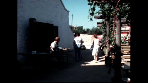 People Walking by White Building Stock Footage 278410103