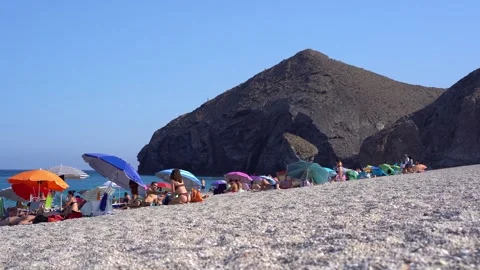 People walking on windy playa de los muertos beach, static Stock Footage 280742079