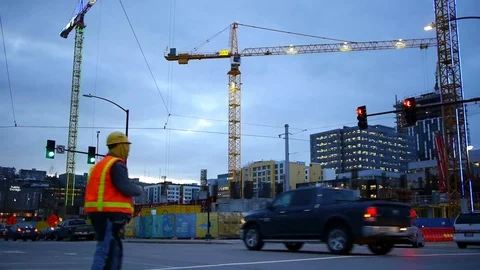 People Walking to Work With Construction Cranes in Background 動画素材 83147539