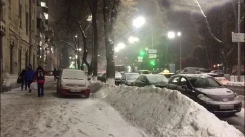 People Walks at the Snow-Covered Side walk in Kiev Street. Stock Footage 101181853