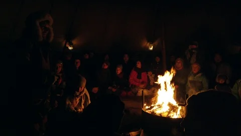 People warming up by the fire Stock Footage 111665681