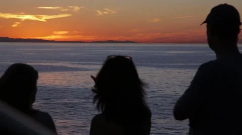 People Watch The Sunset Stock Footage 64217221