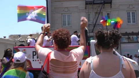 People watching and dancing to the Pride parade on Hollywood Blvd in Los Angeles Stock Footage 197158412