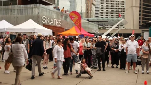 People watching dance performance at Toronto Outdoor Art Fair Video stock 245592940