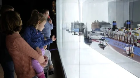 People watching exhibitional vessel models in a museum of water in Wroclaw Stock Footage 73590865