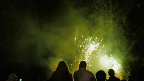 People watching fireworks exploding directly in front of them in slow motion Stock Footage 94044710