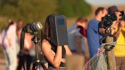 People watching the solar eclipse near Stonehenge Stock Footage 342073991