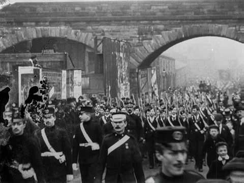 People watching soldiers marching while holding weapons, New Brighton, UK 1904 Stock Footage 136681700