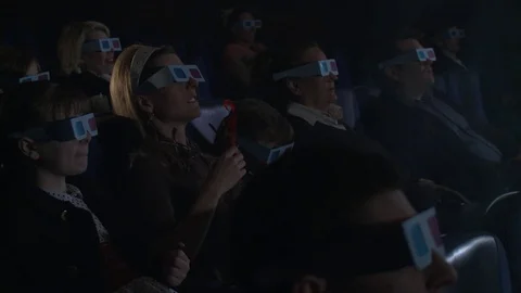 People watching stereoscopic film at theater (vintage15). Stock Footage