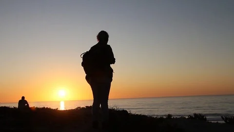 People watching sun set Stock Footage 123200475