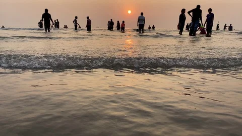 People watching sunset at the beach Stock Footage 126201304