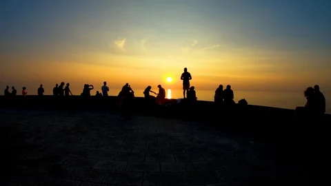 PEOPLE WATCHING THE SUNSET Stock Footage 94230293